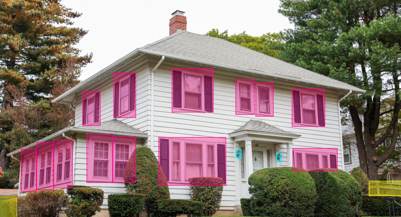 Example of a two-story house exterior with windows, shutters and wall lights annotated with bounding boxes